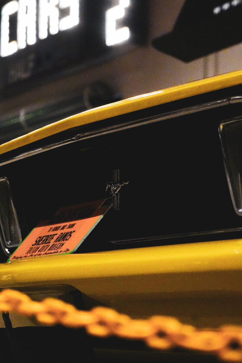 Classic Mustang badge detail at night