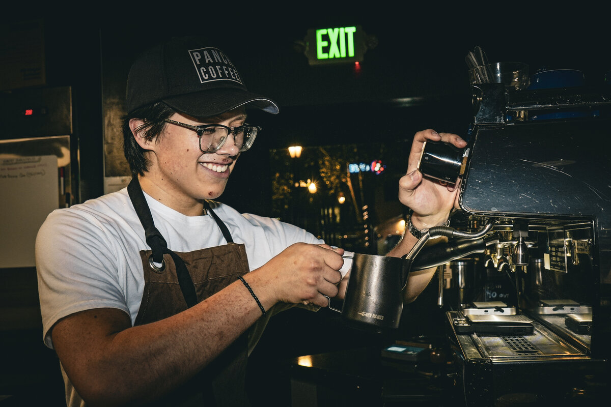 Barista pouring latte art